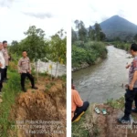 petugas melihat lokasi bocah terseret arus sungai (istimewa)