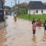 ILUSTRASI Banjir yang terjadi di Kecamatan Cimanggung Kabupaten Sumedang.